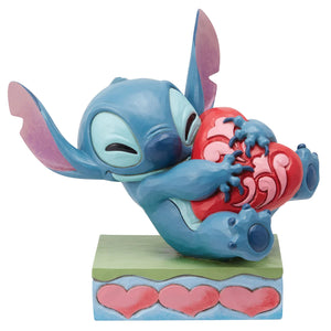 Disney Traditions Stitch Hugging Heart Figurine