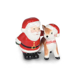 A ceramic Christmas figurine depicting Santa Claus standing next to a small white and tan deer wearing a red and white hat with a red-and-white bow tie.